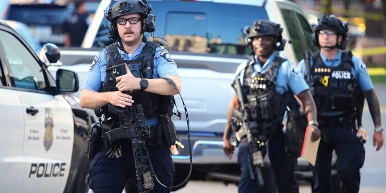 Police respond to a shooting in downtown Minneapolis.