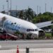 Crews investigate the site of an Amazon cargo plane crash at Miami International Airport on 8 September