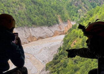 An aerial view from an Mi-17 helicopter shows widespread destruction in Timure, following deadly flash floods and a mudsli...