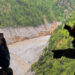 An aerial view from an Mi-17 helicopter shows widespread destruction in Timure, following deadly flash floods and a mudsli...