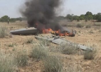Flames rise from a downed drone, in a location given as Hajjah
