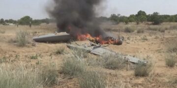 Flames rise from a downed drone, in a location given as Hajjah