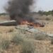 Flames rise from a downed drone, in a location given as Hajjah