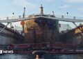 Large boat undergoing maintenance