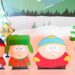 Characters from South Park TV show as cut-outs on a stage with a wintery backdrop.