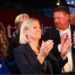 Sweden's Social Democratic Party leader, Magdalena Andersson applauds as she waits with other party members for general election results