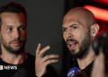 Tristan and Andrew Tate deliver a press statement in front of their house after landing back in Romania, near Bucharest, Romania on 22 March 2025.