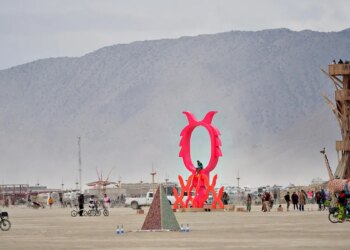 Burning Man attendees sample art during a dust storm at Black Rock City.