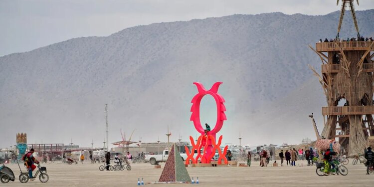 Burning Man attendees sample art during a dust storm at Black Rock City.