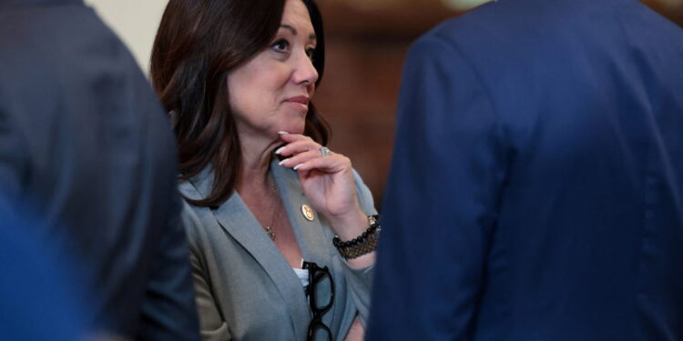 U.S. Labor Secretary Chavez-DeRemer speaks with fellow cabinet members before an event at the White House in Washington