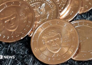US President Donald Trump's portrait on $1 coins, in honor of the nation's 250th anniversary of independence, on the day the coin is released for sale.