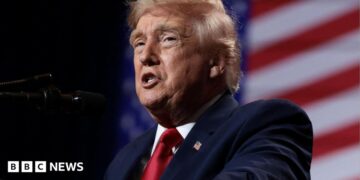 U.S. President Donald Trump delivers remarks at Red Rock Casino Resort Spa in Las Vegas, Nevada, U.S., August 5, 2026. It is a head-and-shoulders shot and he is wearing a blue jacket and shiny red tie.