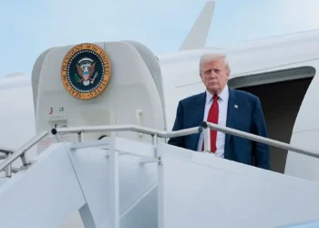 A viral video of Trump carefully climbing Air Force One stairs with safety instructions has sparked age and mobility discussions. (Photo by Anna Moneymaker/Getty Images)