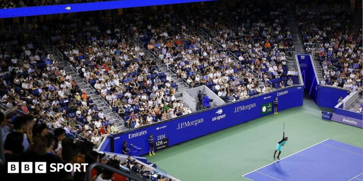 A view above Arthur Ashe Stadium as a light show takes place before the night session