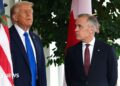 US President Donald Trump speaks to Canadian Prime Minister Mark Carney  during a welcome outside the West Wing of the White House in October 2025