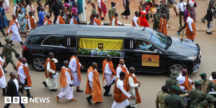 Royal guards escort the cortege with the body of King Oyo Nyimba Kabamba Iguru Rukidi IV for his burial at the Karambi Royal Tombs in Fort Portal, Uganda 12 September, 2026