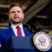 US Vice-President JD Vance speaks behind a lectern