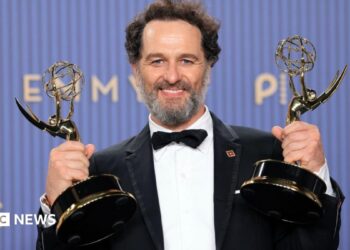 Matthew Rhys, winner of the Outstanding Lead Actor in a Comedy Series Award for "Widow's Bay" and the Outstanding Lead Actor in a Limited or Anthology Series or Movie Award for "The Beast in Me" poses in the press room during the 78th Primetime Emmy Awards at Peacock Theater on September 14, 2026 in Los Angeles, California