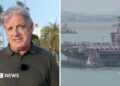 Split image, on the left is a man standing in front of palm trees and a blue sky. On the right is the USS Abraham Lincoln near a port