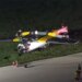 first responders stand near the overturned aircraft