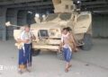 Screengrab of a video from Houthi-run Al Masirah TV showing an armed man walks next to an armoured vehicle in Mocha, Yemen, after the Houthis reportedly seized the Red Sea port city (10 September 2026)