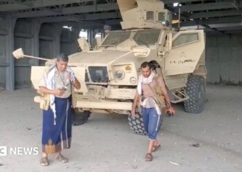 Screengrab of a video from Houthi-run Al Masirah TV showing an armed man walks next to an armoured vehicle in Mocha, Yemen, after the Houthis reportedly seized the Red Sea port city (10 September 2026)